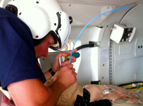 Flight Paramedic intubating a patient - course product image for Distance CME Flight and Critical Care Review course online